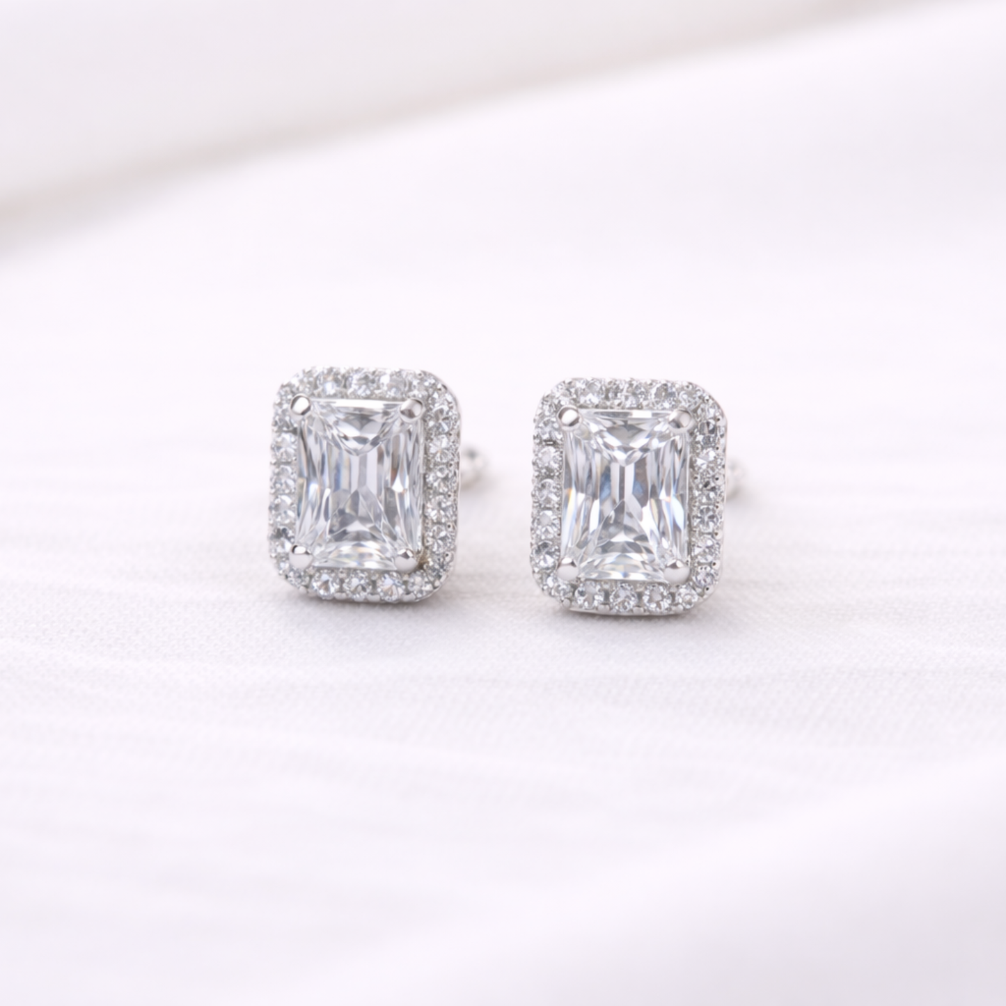 Silver emerald cut halo CZ stud earrings in 925 sterling silver by Eloura Sterling