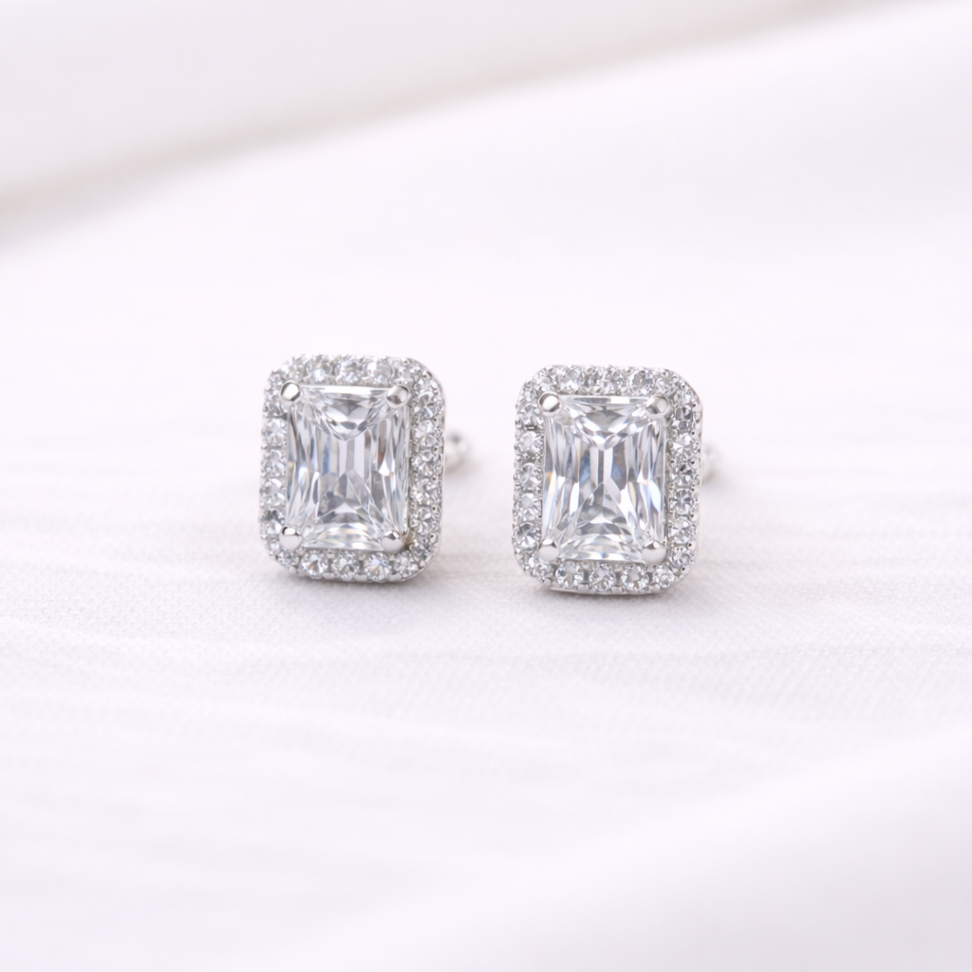 Silver emerald cut halo CZ stud earrings in 925 sterling silver by Eloura Sterling